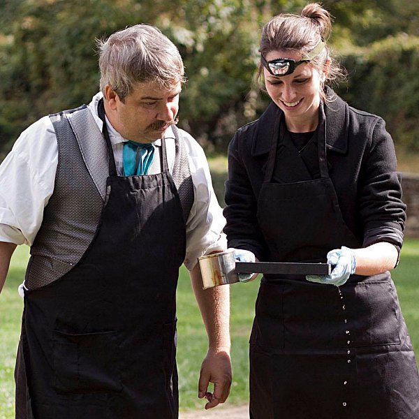 John watching a student fix her own tintype plate.